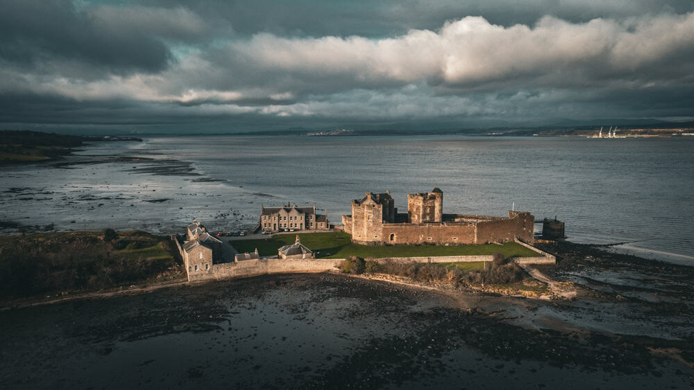 Blackness Castle showing it's ship like shape stretching in to the water
